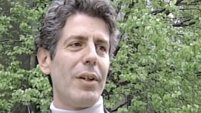 Anthony Bourdain with trees in background