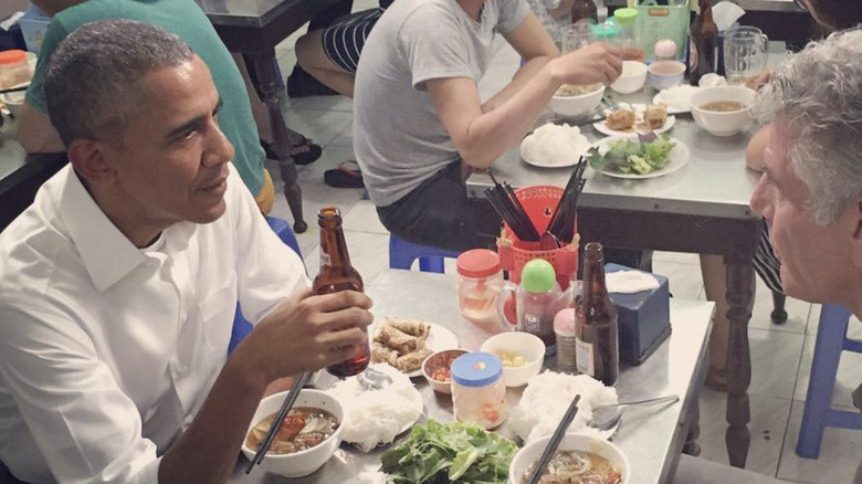 Barack Obama and Anthony Bourdain eating noodle soup