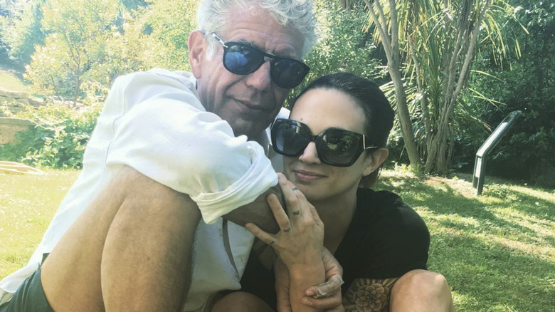 Anthony Bourdain posing with Asia Argento
