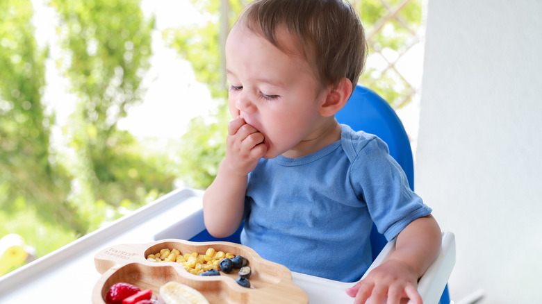 A toddler eating