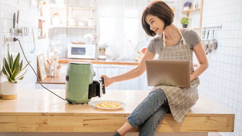 Woman with air fryer