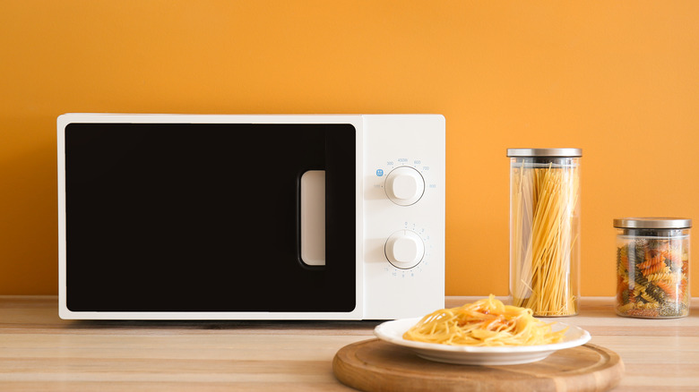 Microwave with cooked pasta