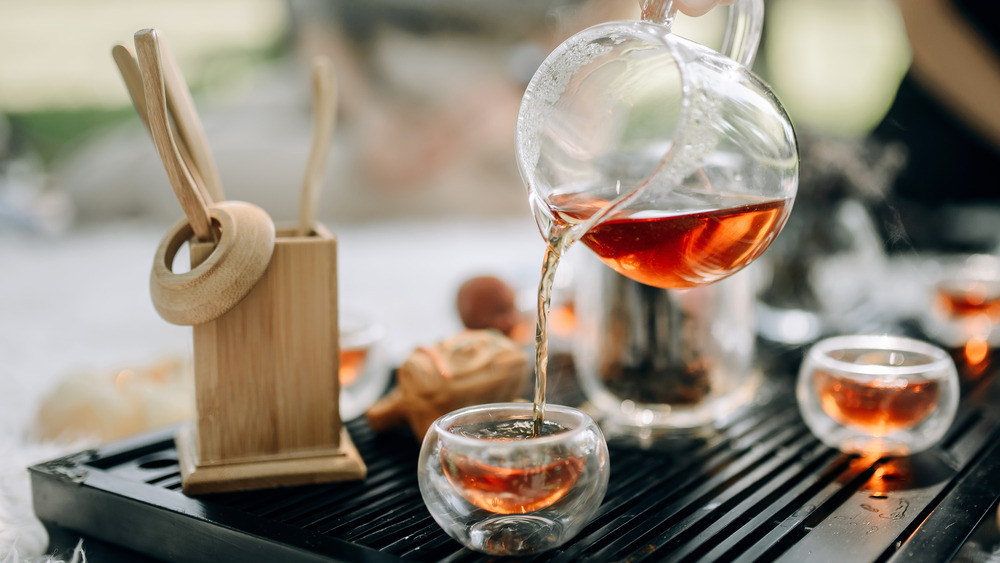 Tea being poured into cup