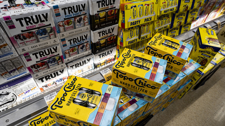 Cartons and boxes of various brands of hard seltzers in store