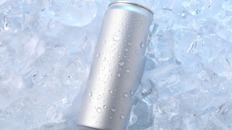 Plain silver beverage can on pile of ice