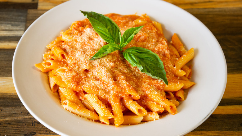 pasta with sauce in white bowl