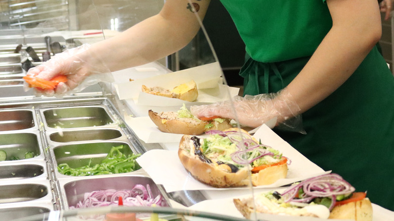 Subway employee making sandwich