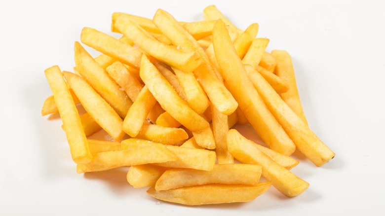 Golden potato chips lightly sprinkled with salt 