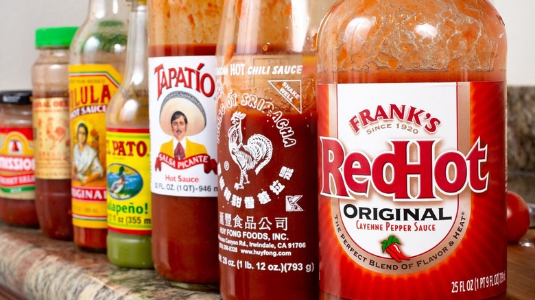 Hot sauce bottles on shelf