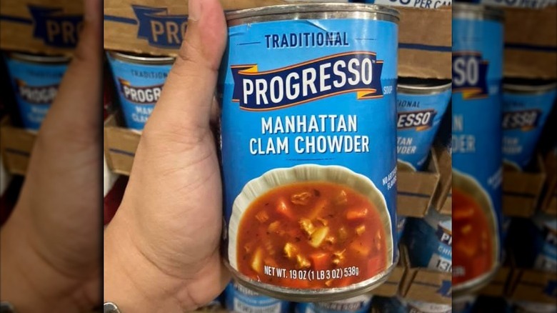 Someone holding can of Progresso Manhattan Clam Chowder