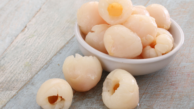 Canned lychee in white bowl