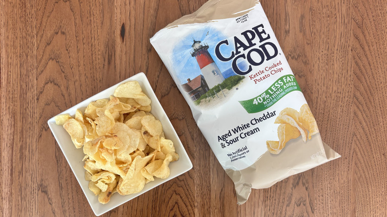 bowl of chips with bag next to it