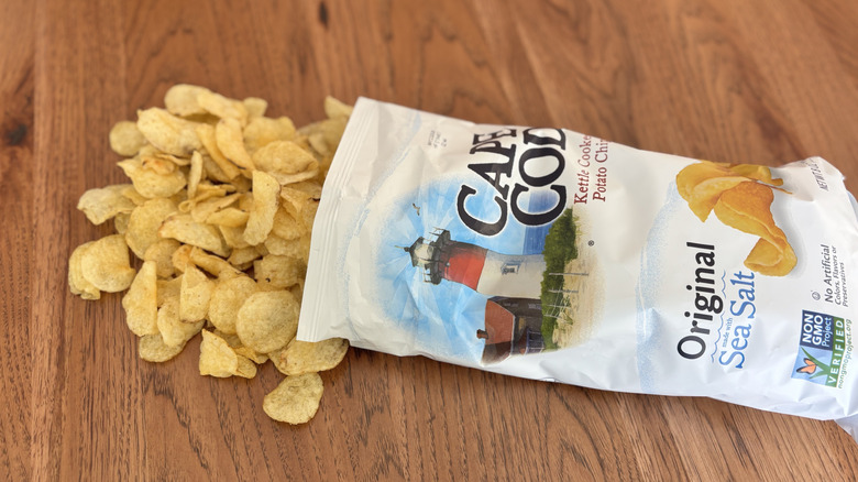 bag of chips with some spilling out onto table