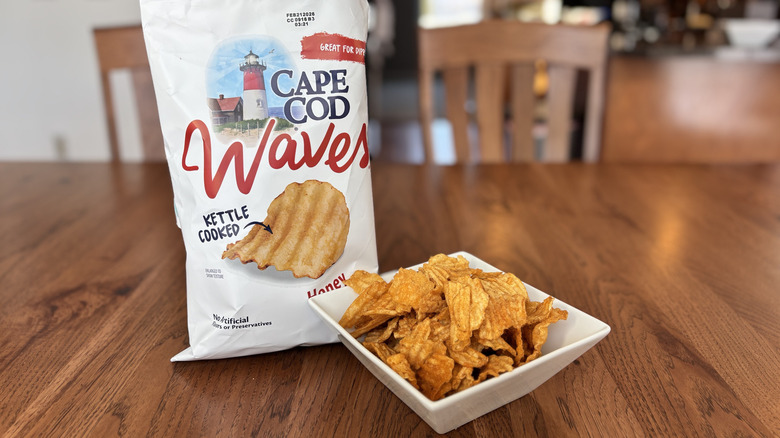 bowl of bbq chips next to bag