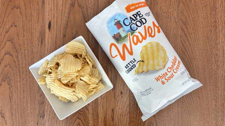 bowl of rippled chips with bag next to it