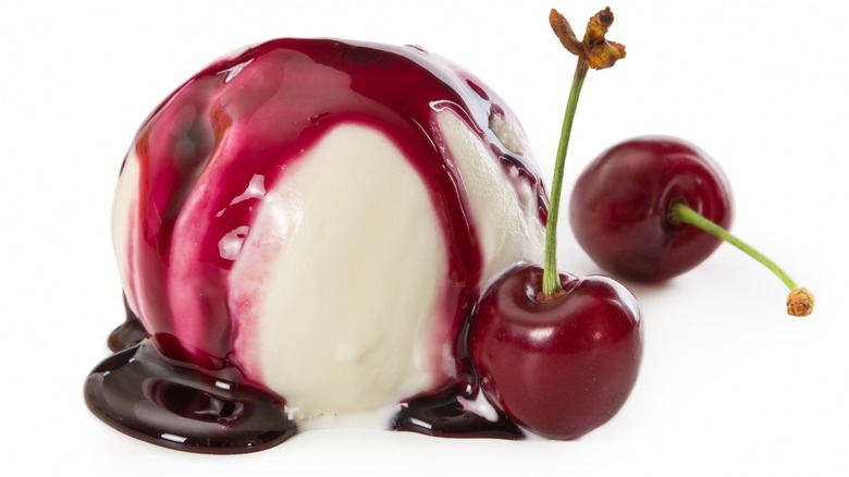 Vanilla ice cream with cherry sauce and cherries