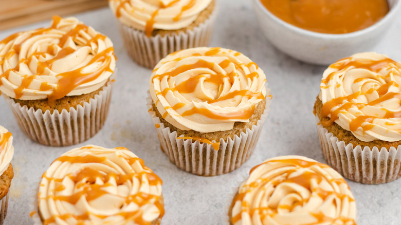 Banoffee cupcakes with caramel syrup drizzled on top