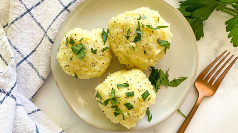 Fufu with parsley on plate