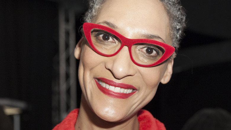 Carla Hall wearing red glasses