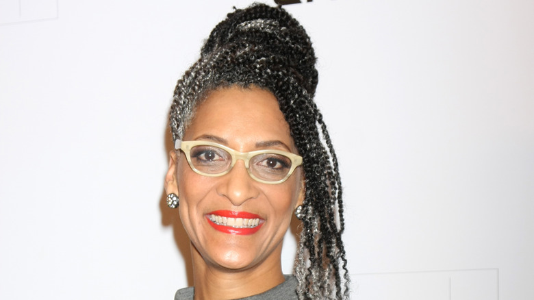 Carla Hall with glasses and red lipstick