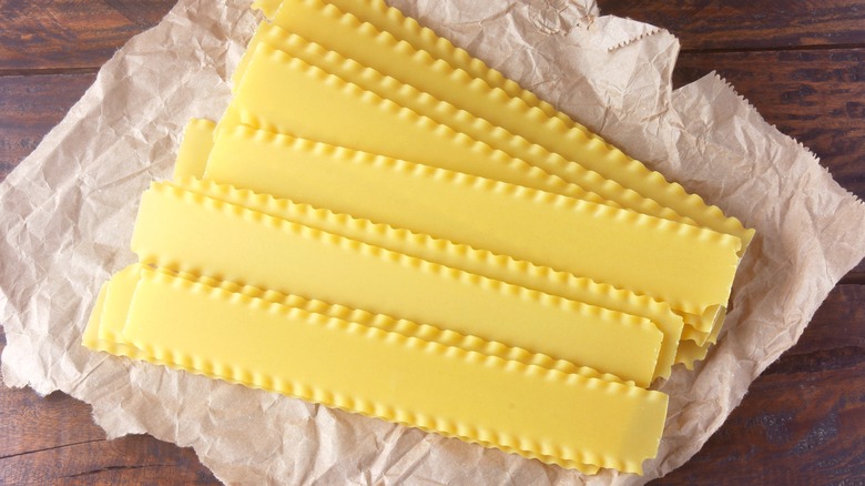 Lasagna noodles on brown paper on table 