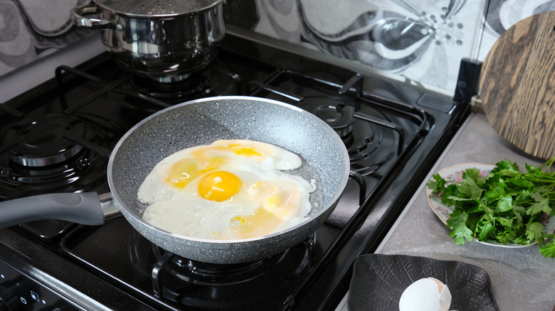 eggs cooking in nonstick pan