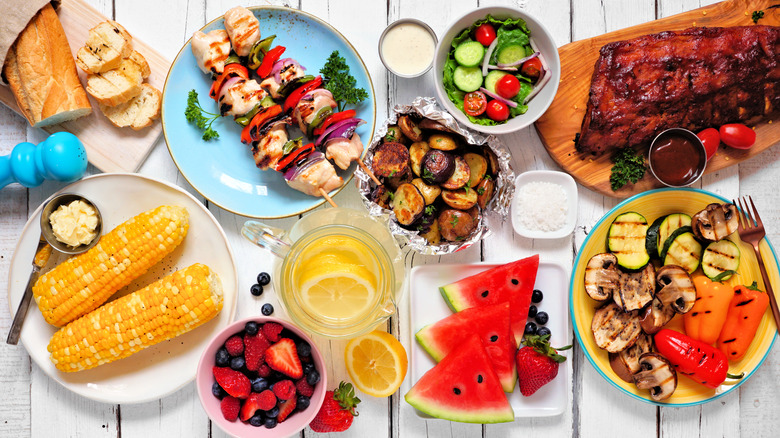 Grilled food set on outdoor table