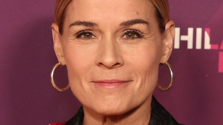 Cat Cora smiling on red carpet