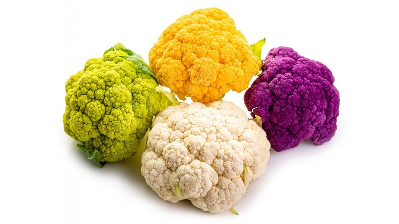 Four heads of colorful cauliflower
