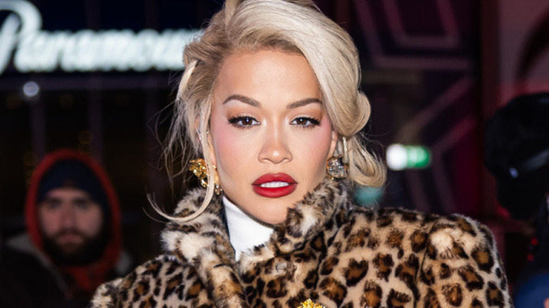 Rita Ora posing for cameras outdoors