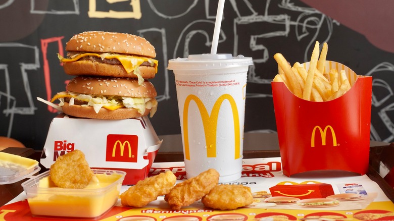 McDonalds hamburgers, chicken nuggets, and fries with a drink