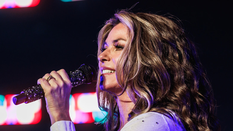 Shania Twain singing into a microphone