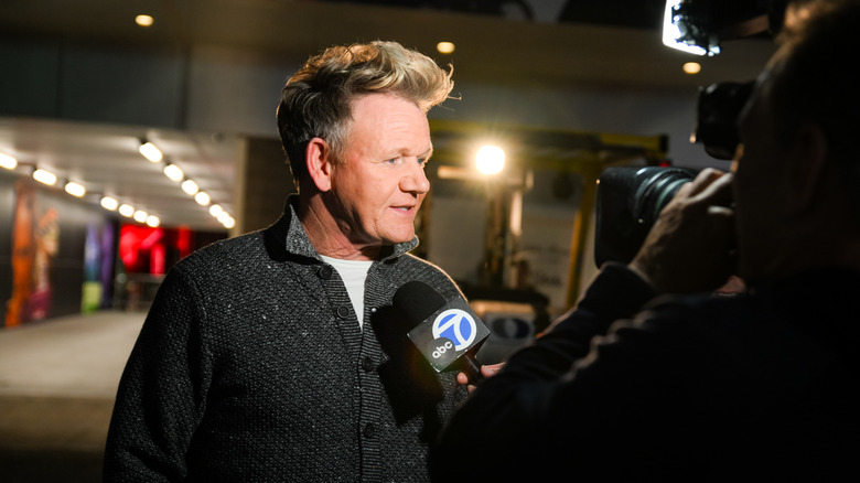 Gordon Ramsay being interviewed by ABC7 at an event