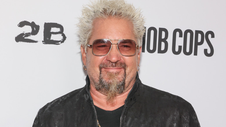 Guy Fieri smiling at publicity event