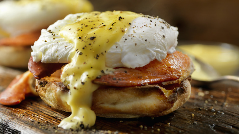Eggs Benedict on wooden surface