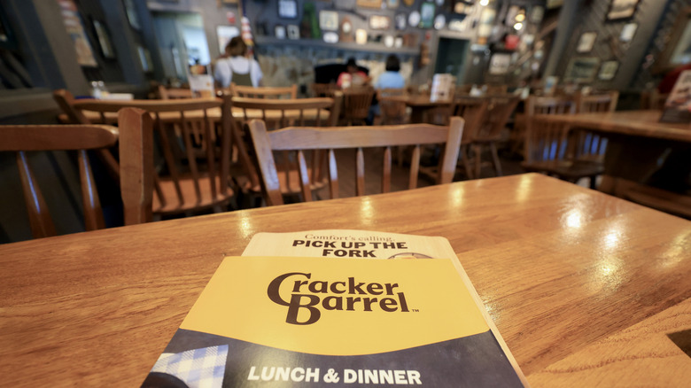 Table height view of Cracker Barrel restaurant with new logo visible on menu