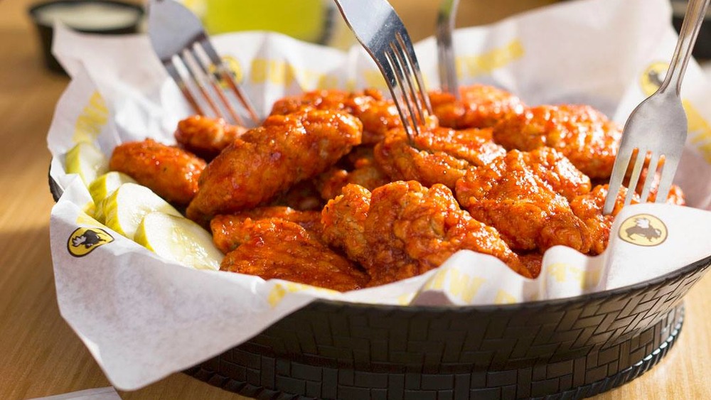 Diners dig into basket of boneless wings