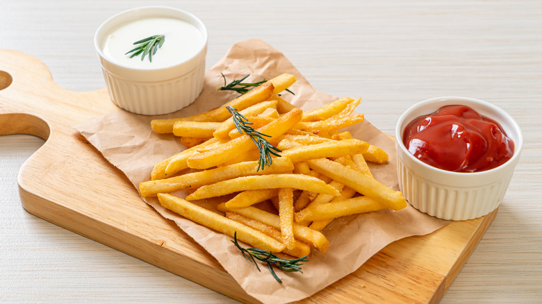 french fries with condiments
