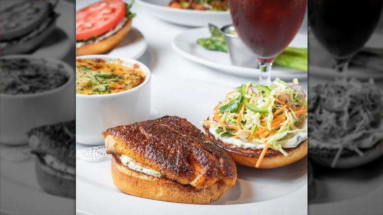 Closeup on blackened fish filet on bun