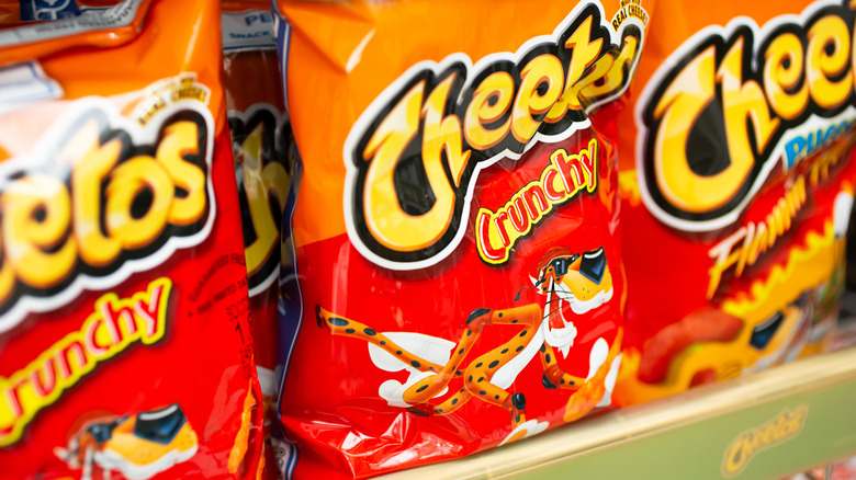 Cheetos crunchy bags on store shelf