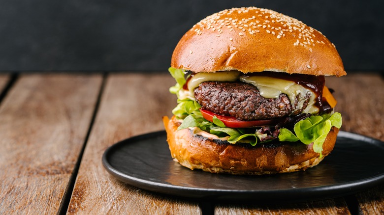 Impossible Burger in bun on black plate