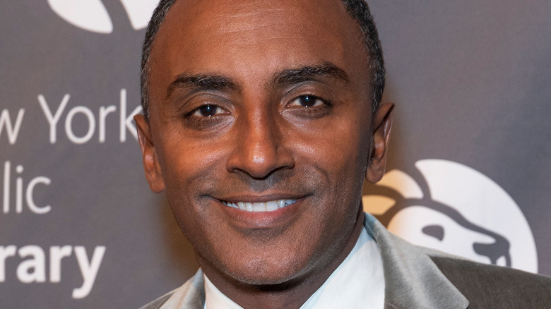 Chef Marcus Samuelsson in a hat smiling
