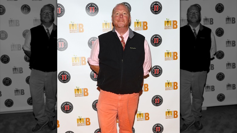 Mario Batali posing at a red carpet event