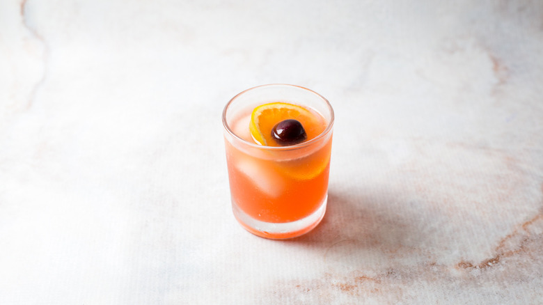 orange cocktail on marble table