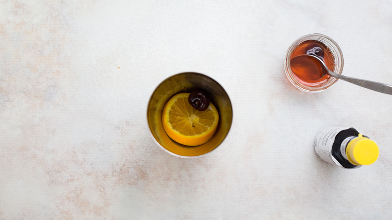fruit sitting in cocktail shaker