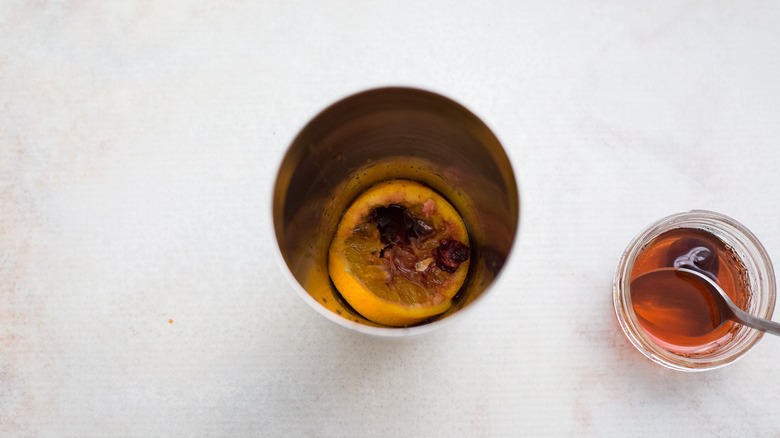 muddled fruit in cocktail shaker