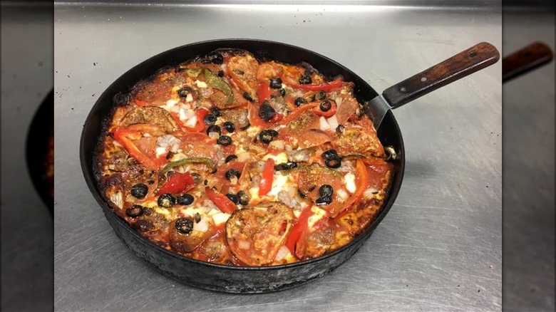 Fully-loaded Burt's Place pizza ready to serve.