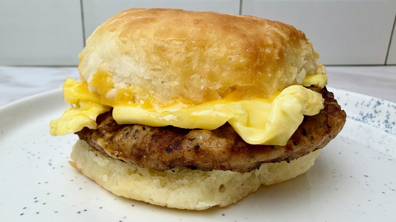 A Chick-fil-A Sausage, Egg & Cheese Biscuit breakfast sandwich