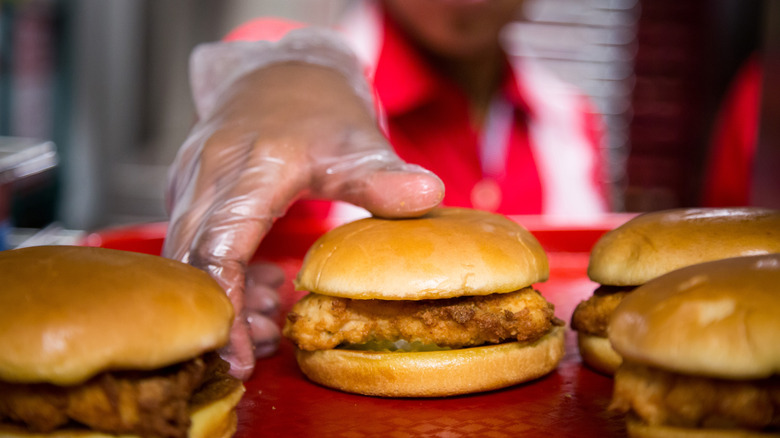 Chick-fil-A employee grabbing sandwich