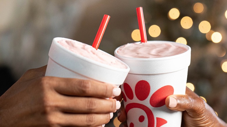 Two people with Chik-Fil-A shakes